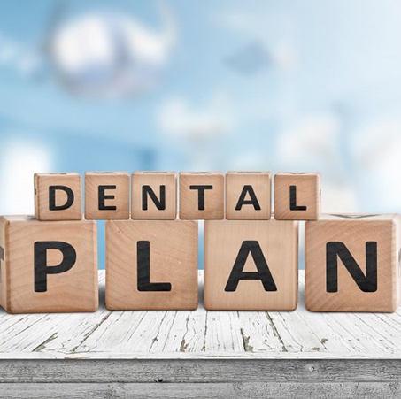 wooden blocks that spell out dental plan