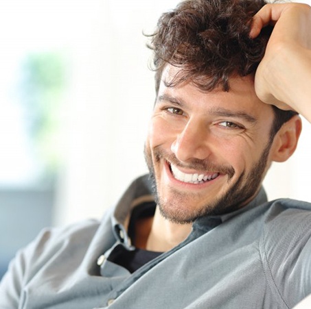 a man smiling with beautiful, straight teeth