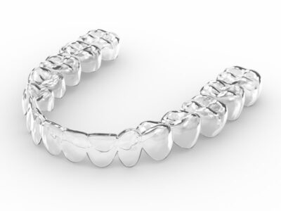 A clear Invisalign aligner.